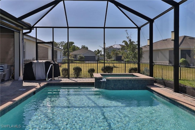 view of swimming pool featuring area for grilling, glass enclosure, and an in ground hot tub