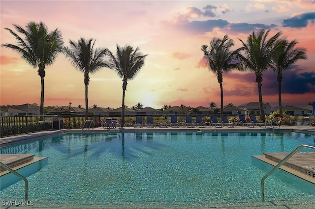 view of pool at dusk