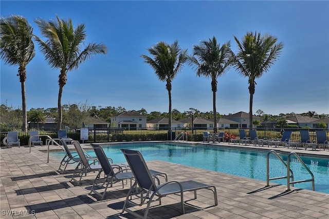 view of swimming pool with a patio area