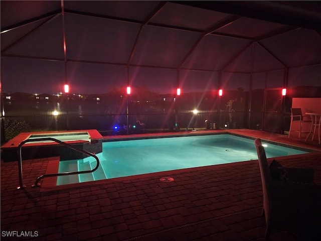 view of pool featuring a lanai and a patio