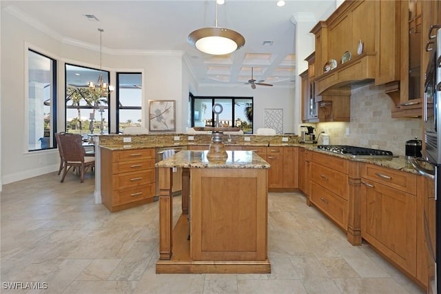 kitchen with coffered ceiling, hanging light fixtures, a kitchen island, kitchen peninsula, and stainless steel appliances