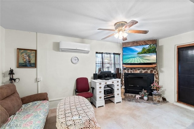 living room with ceiling fan, a stone fireplace, and a wall mounted air conditioner