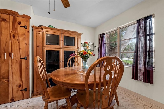 dining space featuring ceiling fan