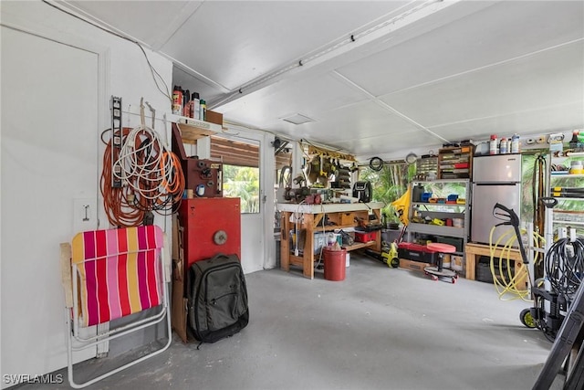 garage with a workshop area