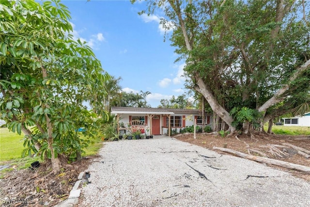 ranch-style home with covered porch