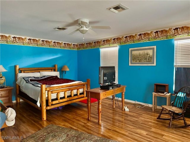 bedroom featuring hardwood / wood-style floors and ceiling fan