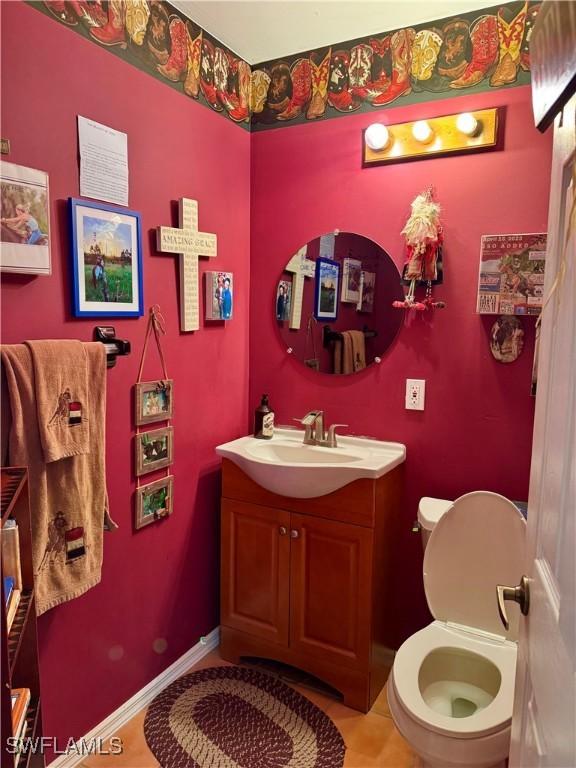 bathroom featuring vanity and toilet