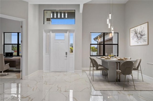 entrance foyer featuring a towering ceiling