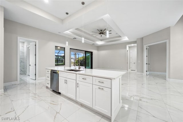 kitchen featuring a center island with sink, white cabinets, stainless steel dishwasher, a raised ceiling, and sink