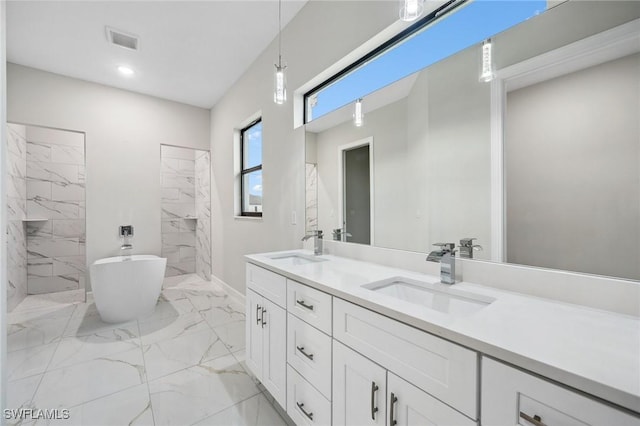 bathroom with vanity and independent shower and bath