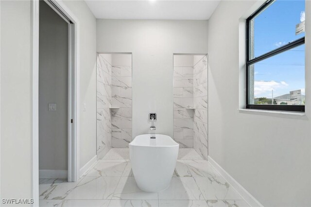 bathroom featuring shower with separate bathtub