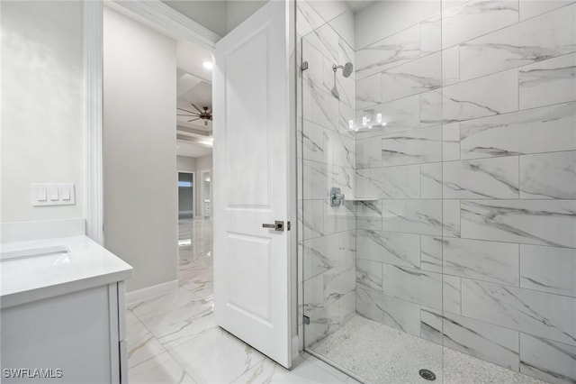 bathroom featuring tiled shower, ceiling fan, and vanity