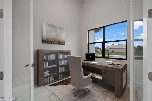 office space with a high ceiling