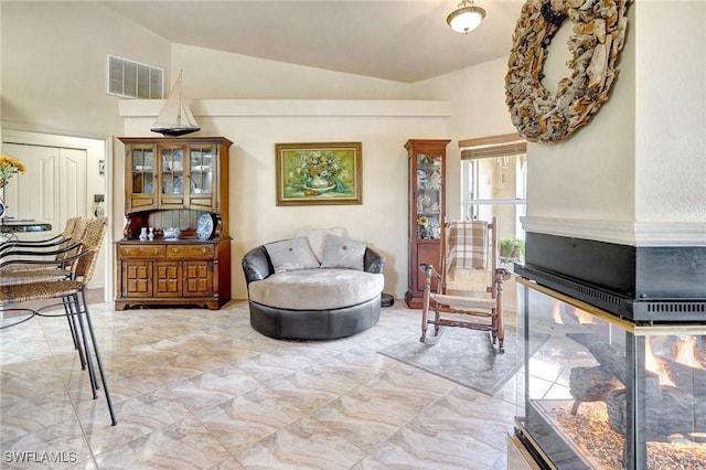 living area with lofted ceiling