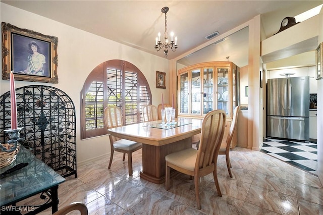 dining room featuring a chandelier