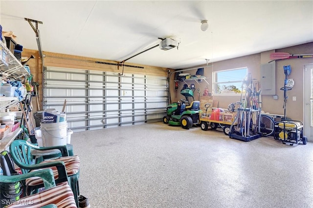 garage with electric panel and a garage door opener