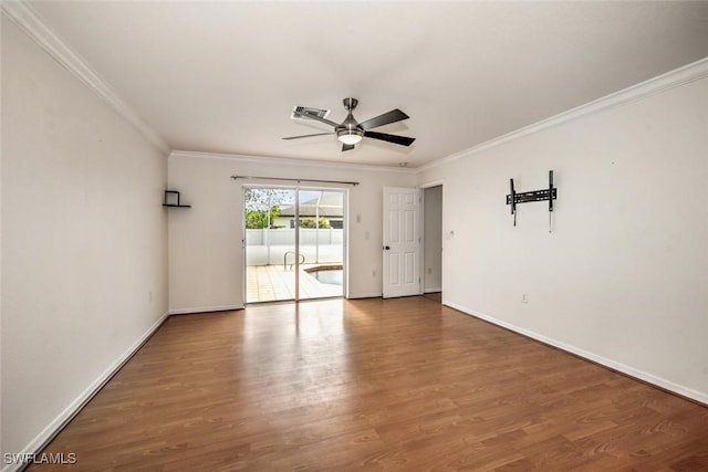 spare room with ceiling fan, wood-type flooring, and ornamental molding