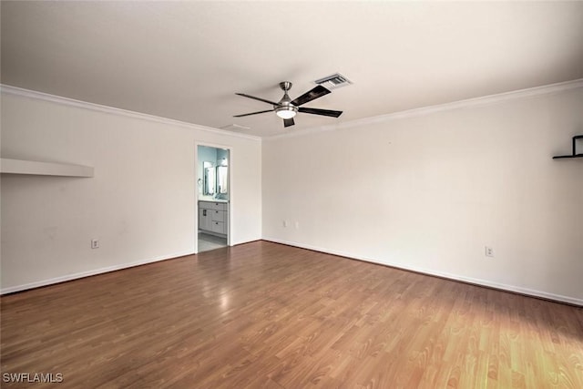 spare room featuring ceiling fan, wood-type flooring, and ornamental molding