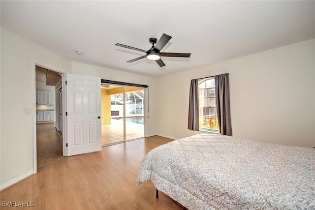 bedroom with access to exterior, ceiling fan, and wood-type flooring