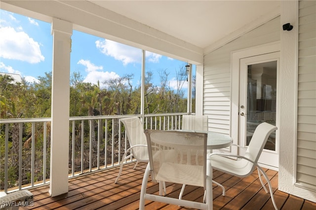 sunroom / solarium with vaulted ceiling