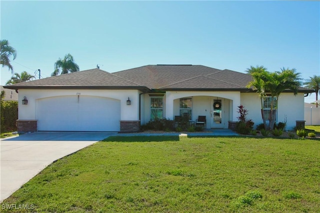 ranch-style house featuring a garage and a front lawn