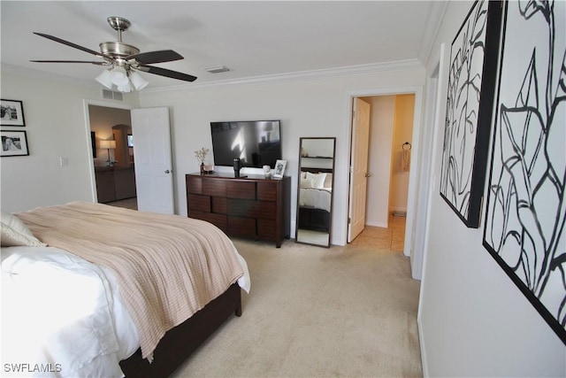 carpeted bedroom featuring ceiling fan, crown molding, and ensuite bathroom