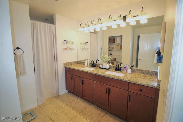 bathroom with tile patterned floors and vanity