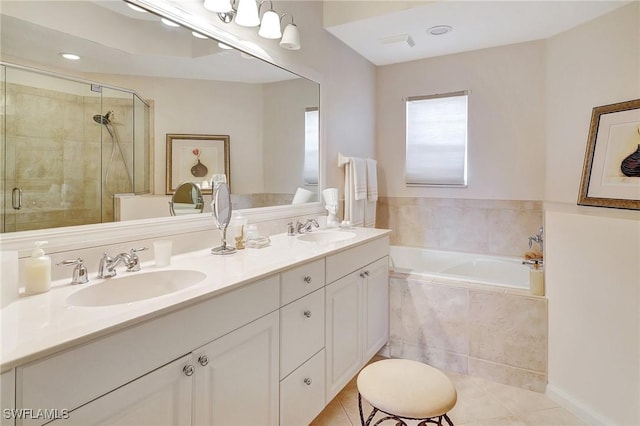 bathroom featuring tile patterned flooring, separate shower and tub, and vanity