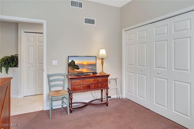 sitting room with light colored carpet