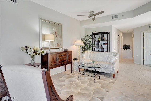 sitting room with ceiling fan and light tile patterned floors