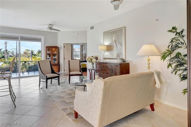 living room with ceiling fan and light tile patterned floors