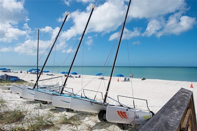 property view of water featuring a beach view