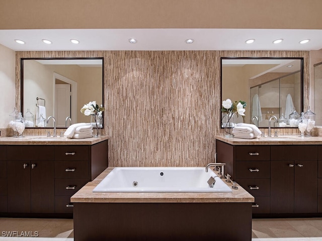 bathroom featuring tile patterned flooring and vanity