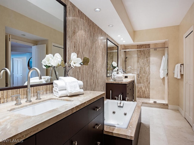 bathroom featuring separate shower and tub and vanity