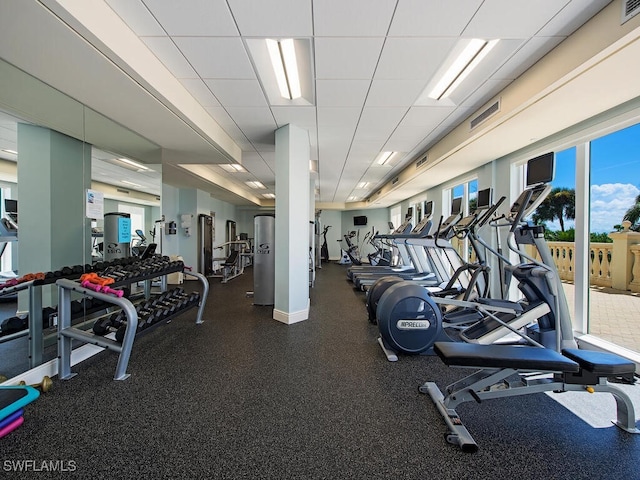 workout area with a drop ceiling