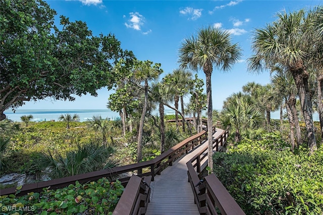 surrounding community featuring a water view