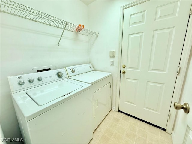 laundry room featuring washing machine and dryer