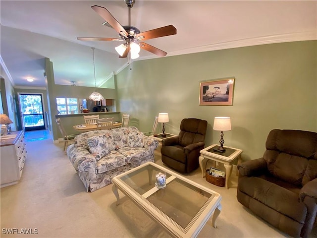 living room with light carpet, crown molding, vaulted ceiling, and ceiling fan