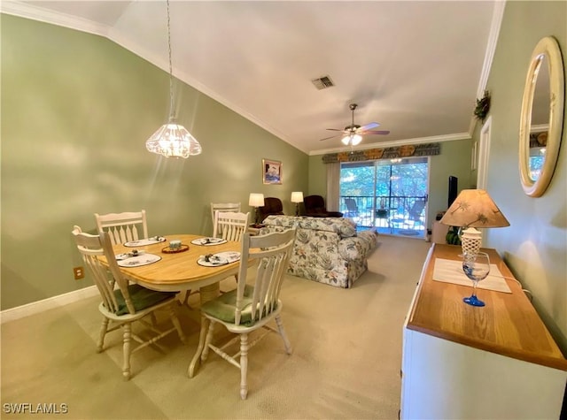 dining area featuring ceiling fan, ornamental molding, light carpet, and lofted ceiling