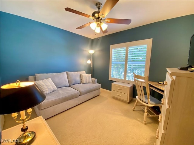 home office featuring light colored carpet and ceiling fan