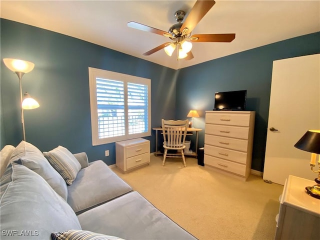 office area with light colored carpet and ceiling fan