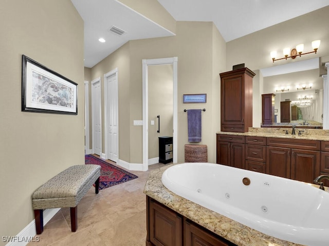 bathroom with vanity and a bathing tub