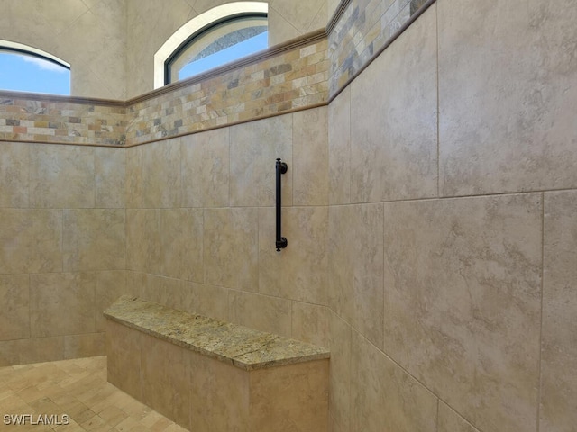 bathroom with tiled shower