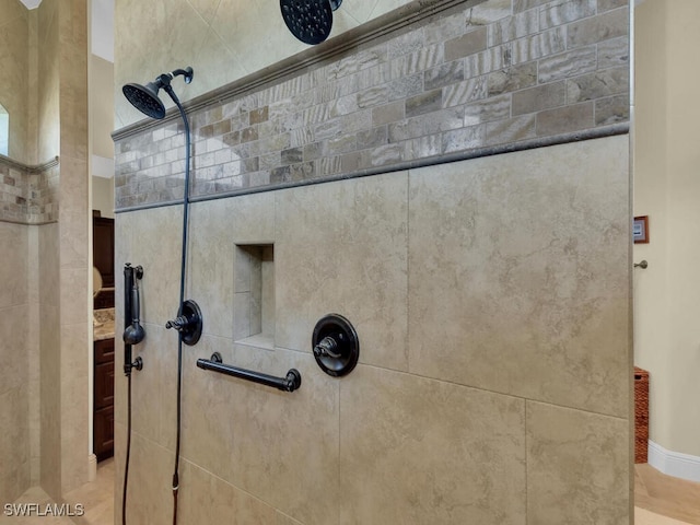 interior details with a tile shower