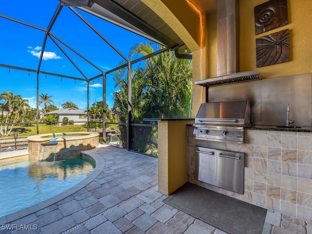 view of patio / terrace featuring exterior kitchen, sink, a lanai, a pool with hot tub, and area for grilling