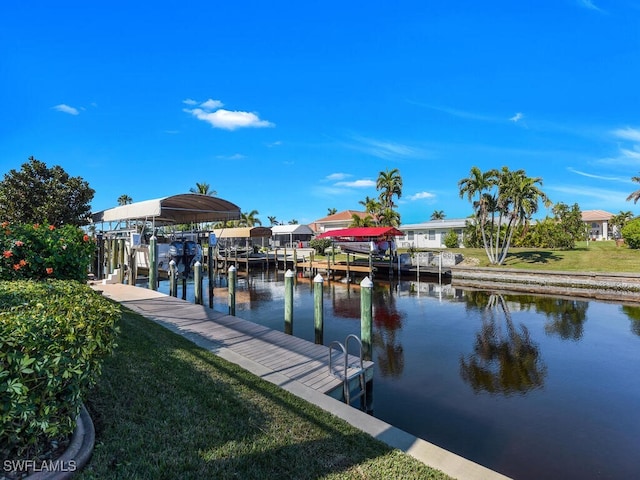 dock area with a water view and a lawn