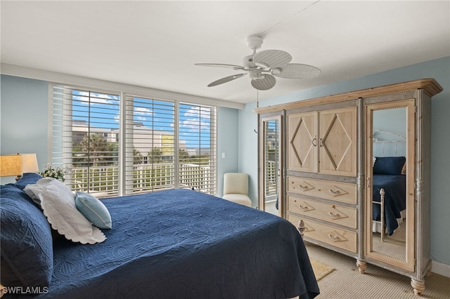 bedroom featuring light carpet, access to outside, and ceiling fan