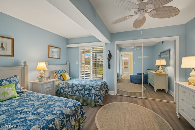 bedroom featuring wood-type flooring, a closet, and ceiling fan