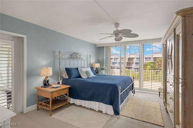 carpeted bedroom featuring access to exterior and ceiling fan