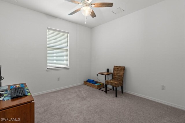 sitting room featuring light colored carpet and ceiling fan